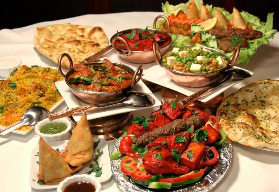 A colourful selection of curries, rice, naan and tandoori dishes at The Lamp