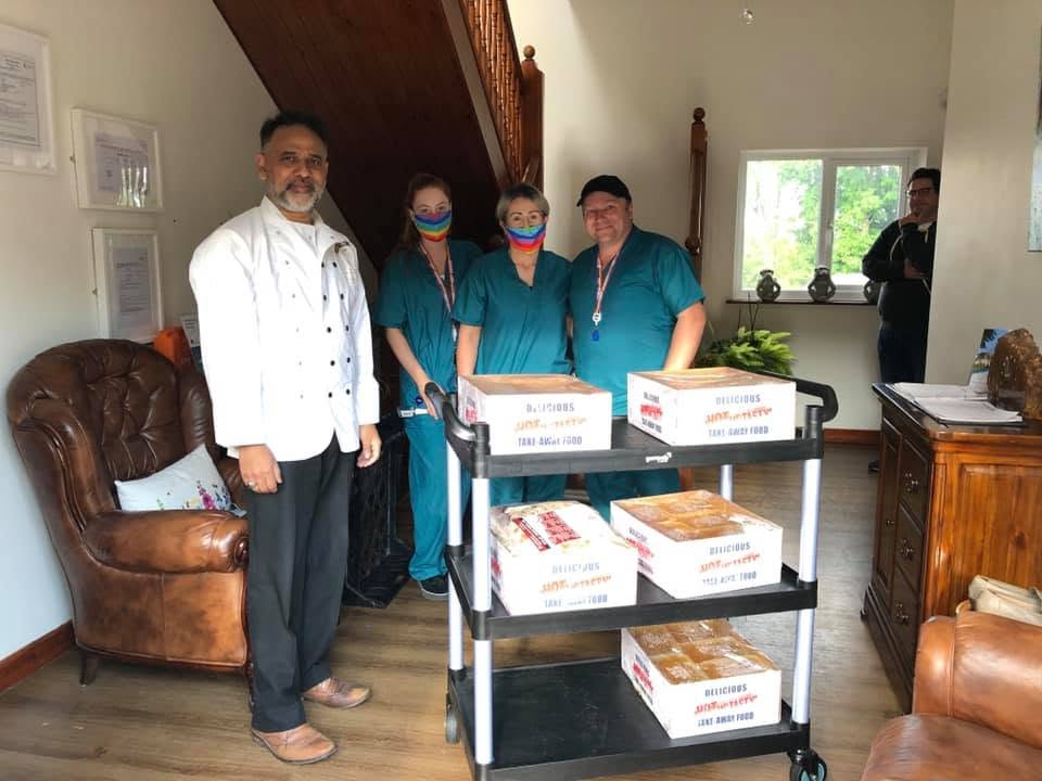 The Lamp team with a delivery of freshly prepared meals